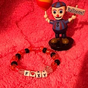 Colorful Beaded Bracelet with Toy Figure